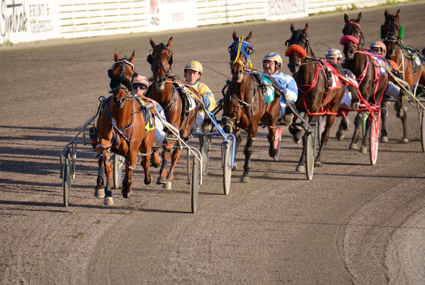 Nogreatmischief, with Walter Cheverie in the bike, leads the field down the backstretch during Race 6 Saturday at Red Shores at the Charlottetown Driving Park.