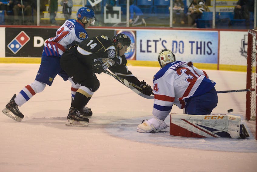 Charlottetown Islanders centre Nikita Alexandrov redirects a pass past Moncton Wildcats goalie Francis Leclerc Thursday during Quebec Major Junior Hockey League action at the Eastlink Centre.