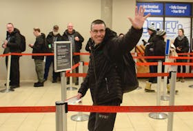 Shawn Mitchell waves to supporters at the Charlottetown Airport Sunday morning before departing for Thunder Bay, Ont., to participate in the Special Olympics Canada Winter Games floor hockey competition.