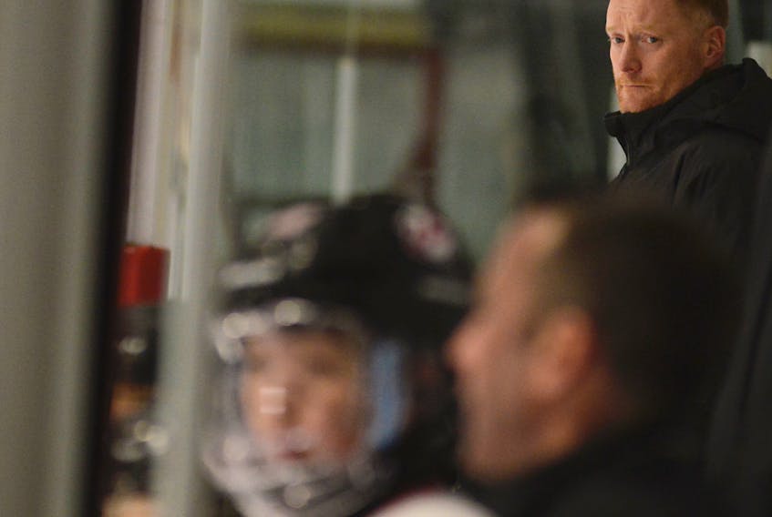 Gordie Dwyer is helping to coach his sons' hockey teams this season.