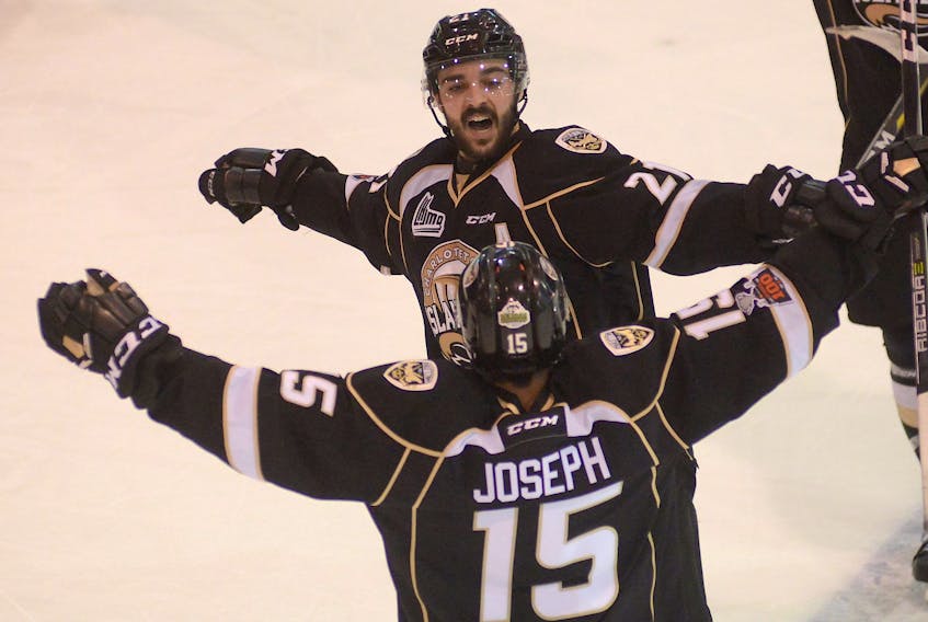 Pascal Aquin celebrates with Pierre-Olivier Joseph after Joseph scored a goal in Game 3 of the Charlottetown Islanders second-round playoff series with the Halifax Mooseheads Tuesday in Charlottetown.