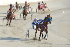 Kimball B, with Mike McGuigan in the bike, leads the field out of the backstretch during Race 2 Saturday at Red Shores at the Charlottetown Driving Park.