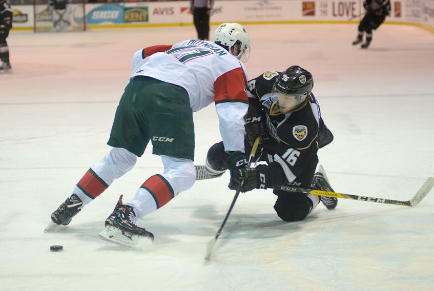 Charlottetown Islanders forward Keith Getson, a Bridgewater native, fires a shot while being defended by Halifax Mooseheads forward Connor Moynihan during Wednesday's Game 4 in Halifax.
