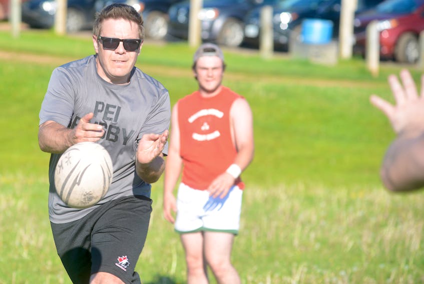 Shaun Younker of the Hunter’s Ale House Mudmen Old Boys passes the ball to a teammate during Tuesday’s practice at Co-op Field in Charlottetown.