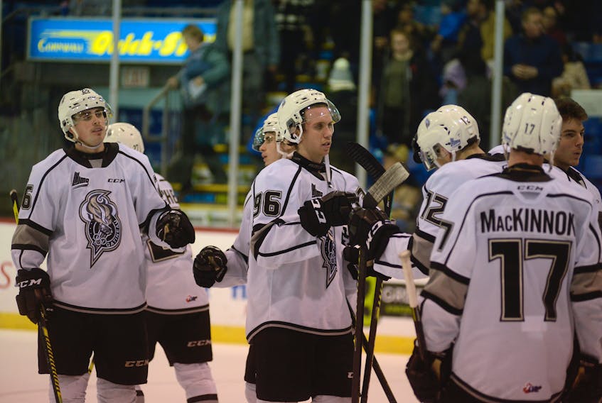 Gatineau Olympiques players, including Charlottetown's Chris McQuaid, former Charlottetown Islanders forward Matthew Grouchy and Summerside's Carson MacKinnon, celebrate their 3-0 victory over the Islanders Monday at the Eastlink Centre.