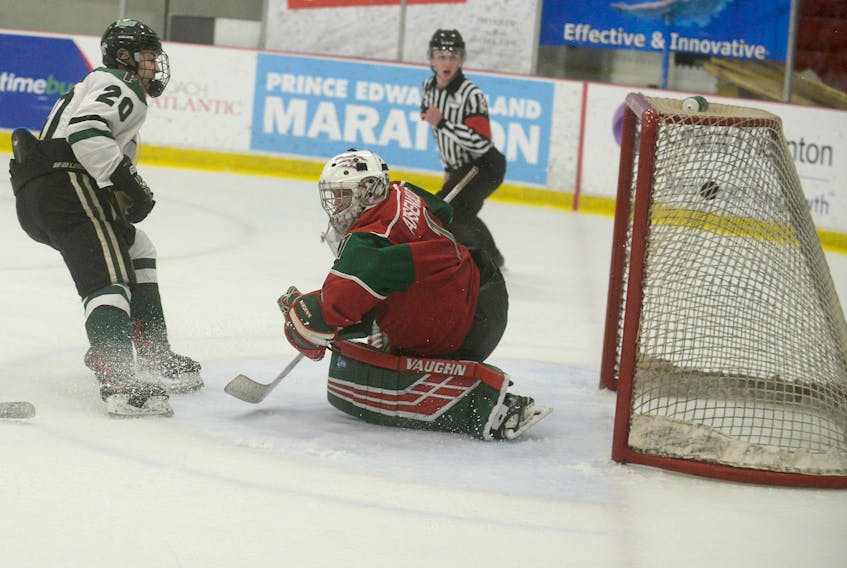 Charlottetown Bulk Carriers Pride forward Cameron MacLean beats Kensington Monaghan Farms Wild goalie Chad Arsenault for the game-tying goal late in the third period of Friday's game at the Atlantic major midget hockey championship in Charlottetown.