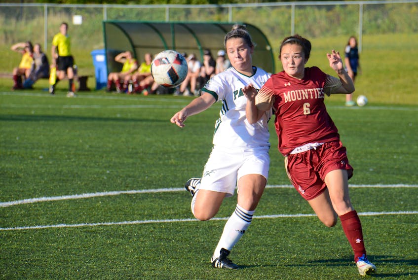 UPEI Panthers rookie forward Madison Hurley, left, and Mount Allison Mounties defender Haruka Kashiwai go after a cross during the Panthers home opener.