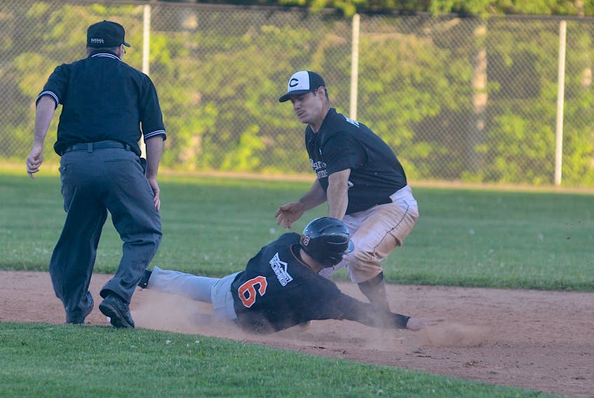 Charlottetown Gaudet's Auto Body Islanders shortstop Dillon Doucette applies the tag to Shawn Bartley as catcher Logan Gallant throws Bartley out trying to steal in the second inning of Tuesday's New Brunswick Senior Baseball League game at Memorial Field.