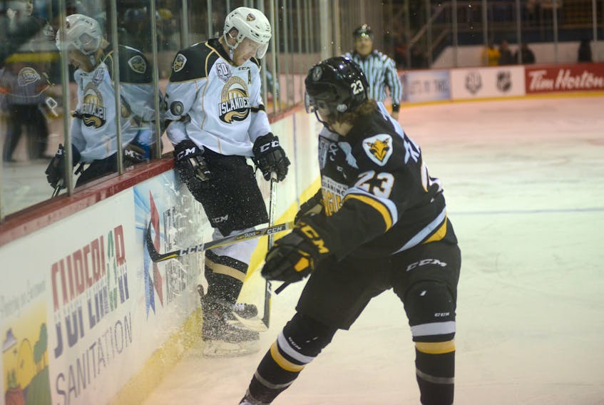 Charlottetown Islanders defenceman Hunter Drew, left, blocks a clearing attempt by Cape Breton Screaming Eagles left-winger Brooklyn Kalmikov during Saturday's Quebec Major Junior Hockey League game at the Eastlink Centre.