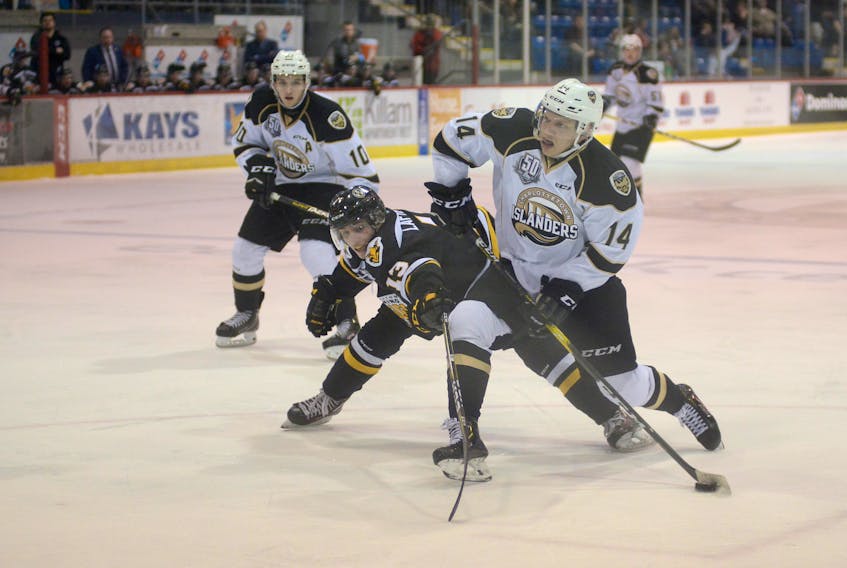 Charlottetown Islanders centre Nikita Alexandrov, right, prepares to take a shot while being defended by Cape Breton Screaming Eagles left-winger Felix Lafrance Saturday during Quebec Major Junior Hockey League action at the Eastlink Centre.