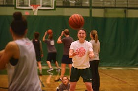 Jenna Mae Ellsworth takes a pass from a teammate at Monday's practice.