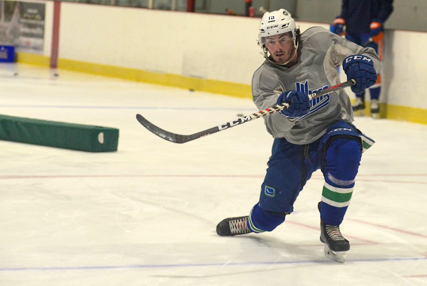 Zack MacEwen watches a shot during a skate with other Island professional hockey players in August at the Pownal Sports Centre.