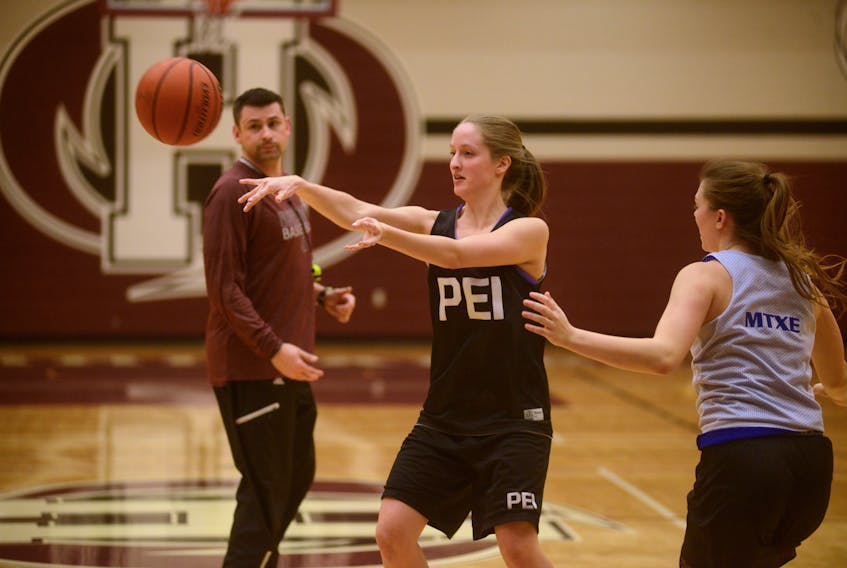 Ashley Plaggenhoef makes a pass to a teammate during Holland College Hurricanes women’s basketball practice on Thursday.