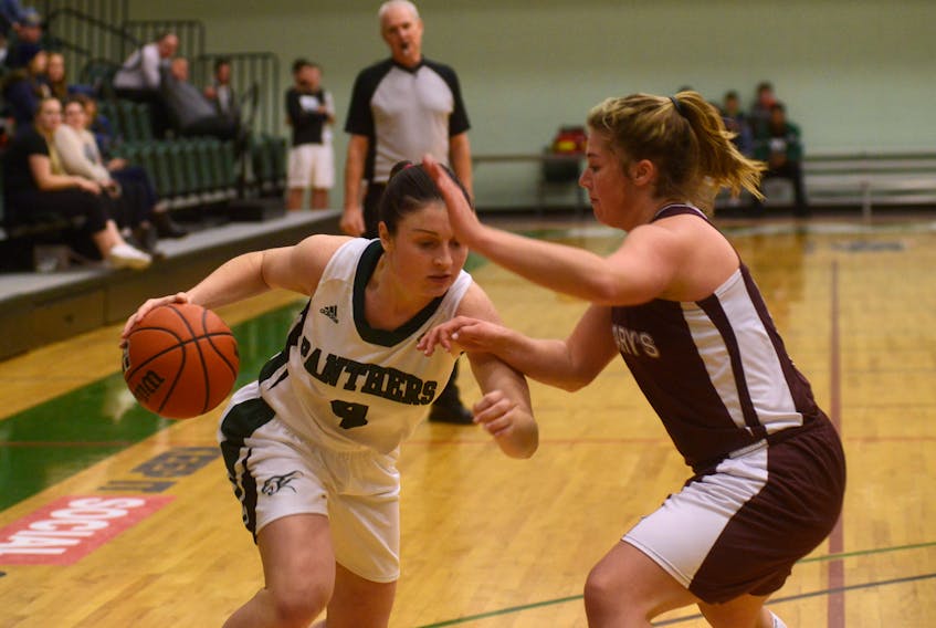 UPEI Panthers guard Jenna Mae Ellsworth tries to drive to the paint while being defended by Saint Mary's Huskies Jada Yeo Friday during Atlantic University Sport basketball action in Charlottetown. The women were teammates on the high-powered Colonel Gray Colonels teams a few years ago. Both are in their third university seasons.