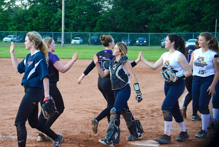 Members of the West Township Tigers and Pro Cresting Stealers shake hands after a recent game in the Island Female Fastpitch League at City Diamond in Charlottetown.