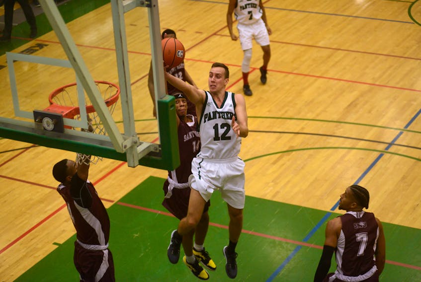 UPEI Panthers fifth-year forward Milorad Sedlarevic attacks the rim Friday during Atlantic University Sport basketball action with the Saint Mary's Huskies.
