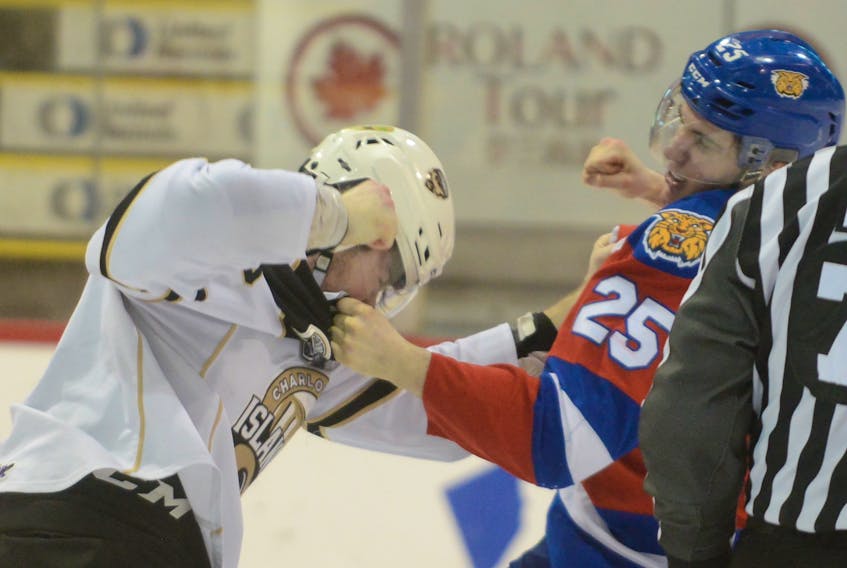 Moncton Wildcats defenceman Sean Stewart, right, fights Charlottetown Islanders winger Liam Peyton in March 2019 during Quebec Major Junior Hockey League action at the Eastlink Centre. The Islanders acquired the blue-liner on Monday.