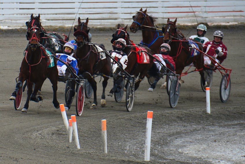 Jetta Flys with Jason Hughes at the controls, right, heads around the turn in Sunday’s Red Shores Charlottetown Pace on the final card of the winter meet at Red Shores at the Charlottetown Driving Park.