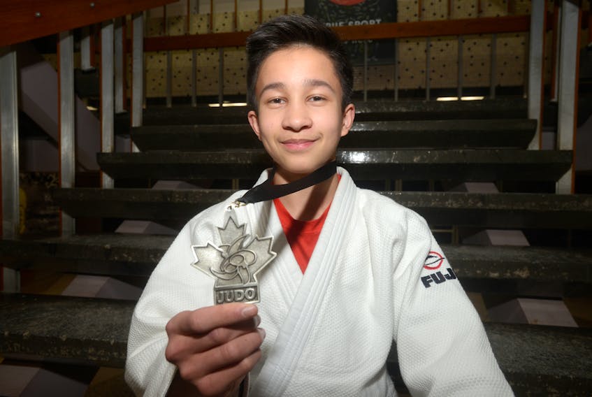 R.J. Hetherington proudly displays the silver medal he won at the Elite National Championship judo competition in Montreal.
