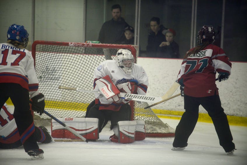 Calgary Rath goalie Breanna Beck stops Atlantic Attack forward Martine Caissie Saturday during the gold medal game of the National Ringette League at the Credit Union Canadian Ringette Championships in Charlottetown.