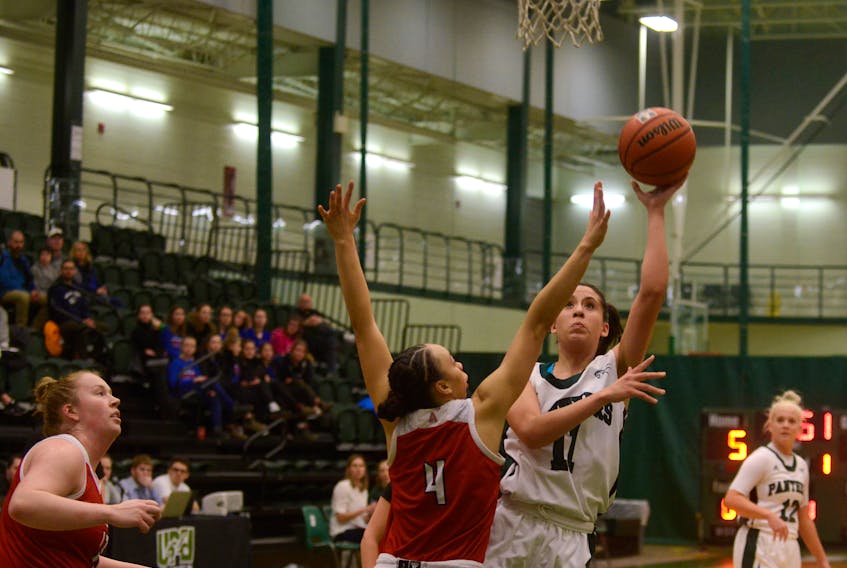 UPEI Panthers forward Karla Yepez, right, takes a shot over Acadia Axewomen's Shalyn Field Friday during Atlantic University Sport basketball action.