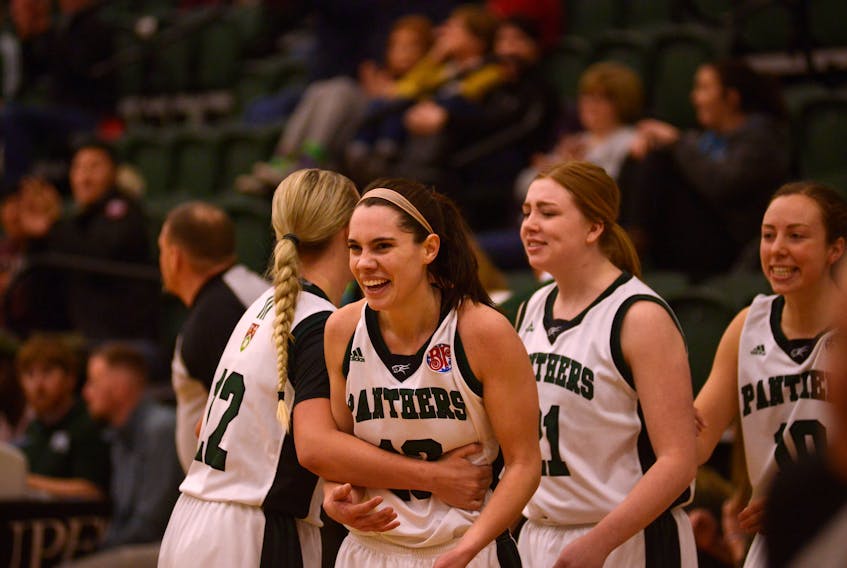 UPEI Panthers forward Kiera Rigby celebrates with her teammates after hitting a three-point shot at the end of the third quarter of Friday's game with the St. FX X-Women.