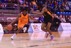 Island Storm guard Johnathan Loyd, left, looks for a drive lane during National Basketball League of Canada action earlier this year.