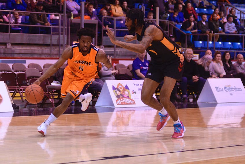 Island Storm guard Johnathan Loyd, left, looks for a drive lane during National Basketball League of Canada action earlier this year.