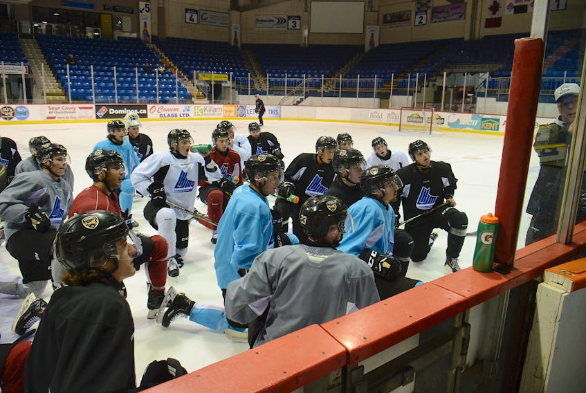 The Charlottetown Islanders listen to a drill from head coach Jim Hulton during Tuesday's practice at the Eastlink Centre.