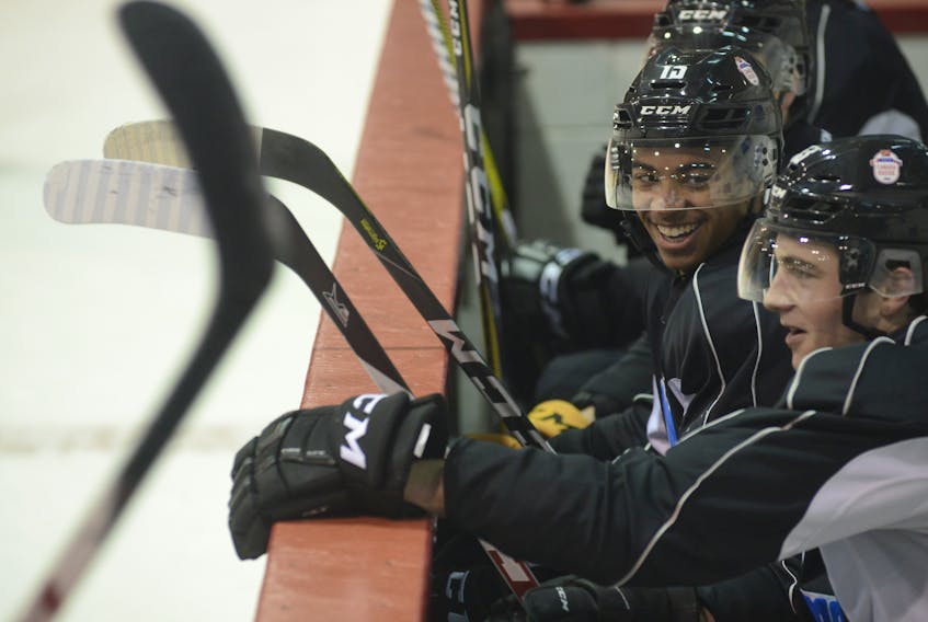 Pierre-Olivier Joseph, left, shares a laugh with Noah Dobson during a practice for the 2017 CIBC Canada Russia Series at the Eastlink Centre. They are playing in this year's two games in Quebec.