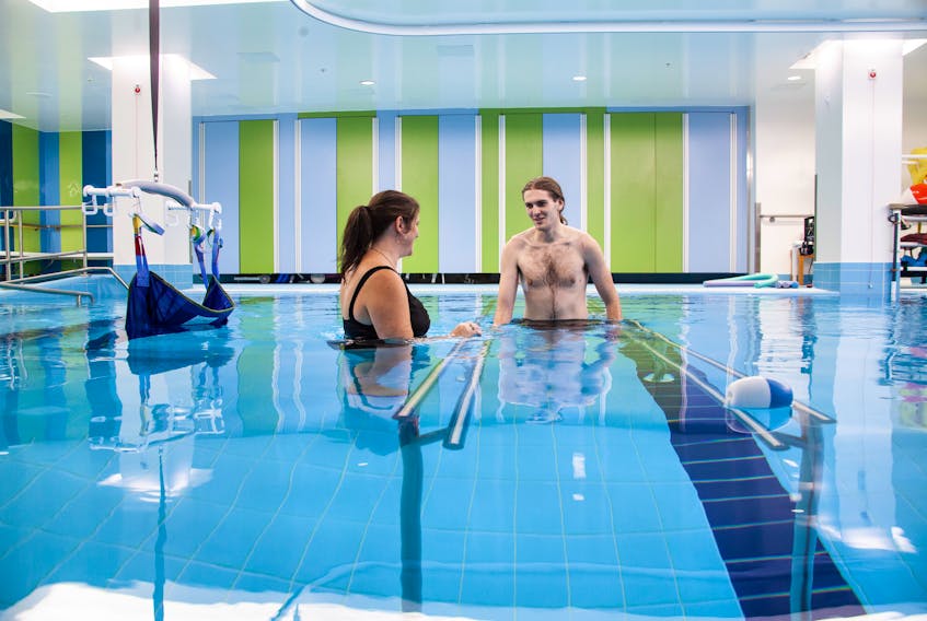 Matthew Upham receiving aquatic therapy in The Grace Hansen Therapeutic Pool at the Nova Scotia Rehabilitation and Arthritis Centre at the QEII Health Sciences Centre from his physiotherapist, Angela Rutledge, as part of his care in recovering from a car accident that occurred in June 2018.