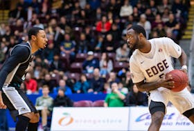In this file photo from the 2018-19 National Basketball League of Canada season, Dez Lee (right) of the St. John’s Edge looks to move the ball past the Moncton Magic’s Gentrey Thomas during a game at Mile One Centre in St. John’s. Lee, who was one of the Edge’s most dependable players during the team’s first two seasons in the NBLC, is set to return to St. John’s, but as a member of the Magic, who are in town for games tonight and Wednesday. — St. John’s Edge file photo/Joe Chase
