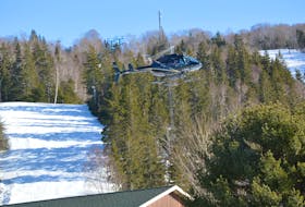 A Breton Air helicopter prepares to land in a designated area near Ski Ben Eoin Wednesday afternoon. The Reserve Mines-based company was offering helicopter rides for those wanting to take a break from the slopes at the Ben Eoin venue. JEREMY FRASER • CAPE BRETON POST