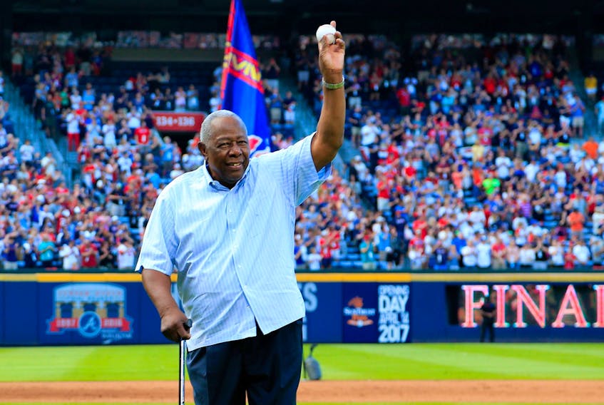 Baseball Hall of Famer Hank Aaron throws out the ceremonial last pitch at Turner Field on Oct. 2, 2016. Aaron passed away on Friday at the age of 86.