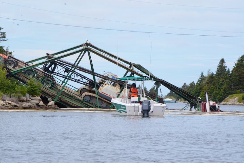 The bridge linking Durells Island to Canso collapsed Tuesday under the weight of a transport truck hauling a crane intended to help in the construction of its' replacement. (AARON BESWICK PHOTO)