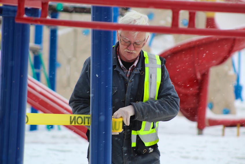 Colin MacLean/Journal Pioneer
City of Summerside employee David MacDonald spent part of his morning Tuesday cordoning off playground equipment around the community. The cities of Summerside and Charlottetown and the Public Schools Branch have all closed their playgrounds to combat the spread of the coronavirus (COVID-19) pandemic. Public parks with no play structures remain open. 