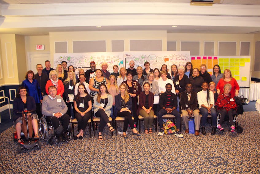 Participants, organizers and attendees gather for a group photo following the conclusion of the Disability, Access, Equity and Education: Creating Welcoming Communities held Aug. 26 and 27 at St. F.X.
