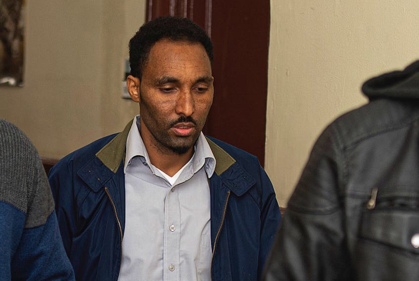 Tesfom Kidane Mengis heads into a courtroom at Halifax provincial court on Tuesday. Mengis is charged with sexually assaulting a female passenger in his cab last year. - File