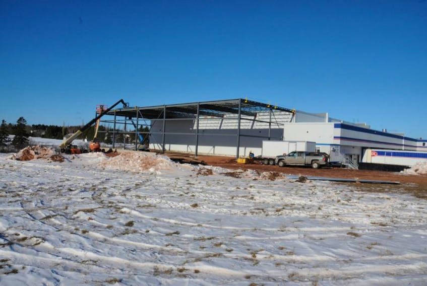 <p>A construction crew work on a new expansion to the Summerside ADL distribution centre. The project will add about 7,500 square feet of space to the existing building and is expected to be completed by April.</p>