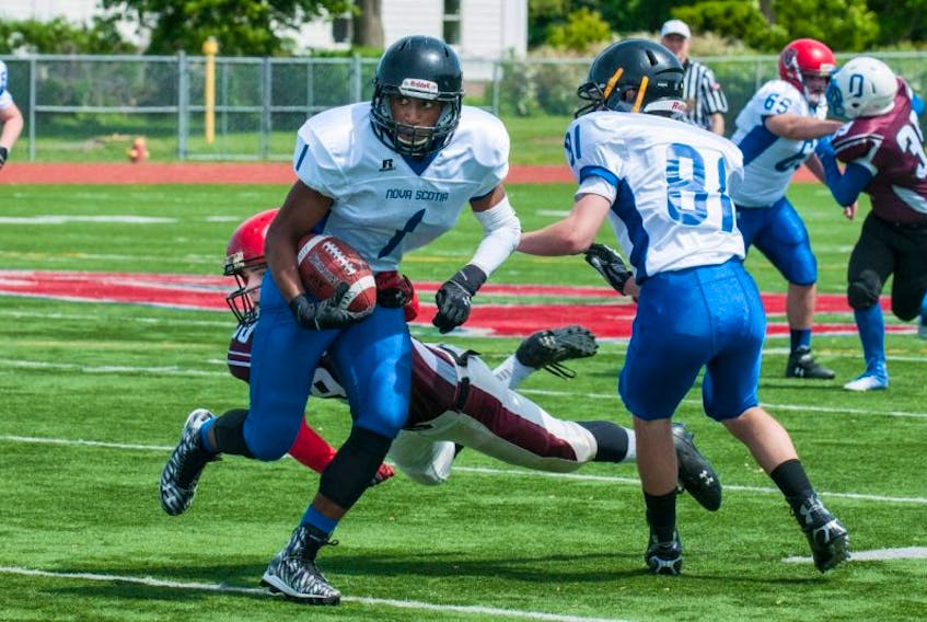 Adre Simmonds (#1) had 246 yards rushing and four touchdowns for Team Nova Scotia in a 41-27 win over New Brunswick in U-17 action June 20 in Wolfville as part of the inaugural Maritime Football Series. Alex Hayes (#81, right) of Kentville was one of six Kings County players on the Team Nova Scotia roster.