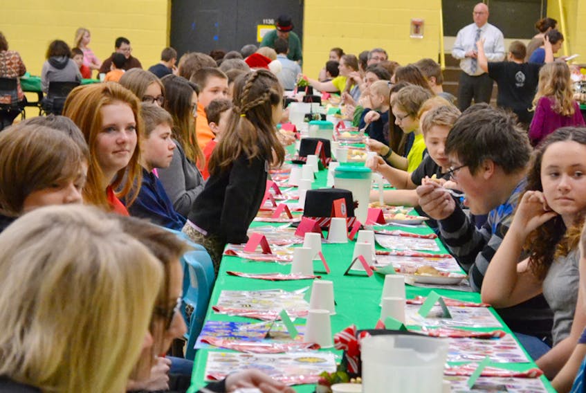 More than 250 people sat down in the gym at North Queens Community School in Caledonia to enjoy a turkey dinner Dec. 19.
