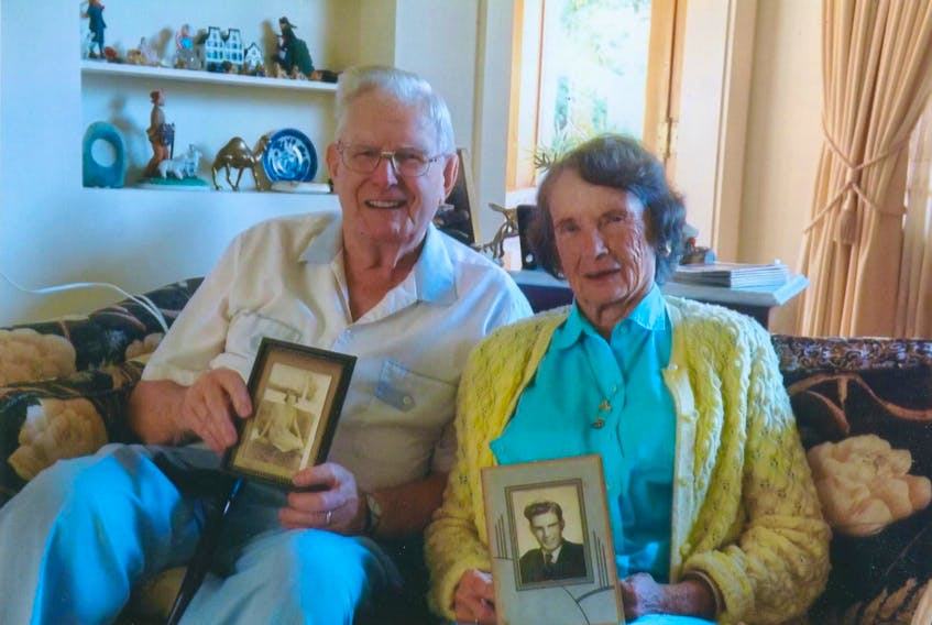 Earl Shute, left, and Edna Leamon Senter hold pictures of their younger selves.