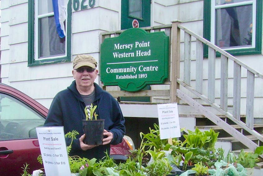 On May 27, there will be a plant sale at the Mersey Point Community Hall to raise funds for the hall’s kitchen. Donations of plants and pots are needed. Event organizer and hall board member, Chris Greatrex shows off some of the wares from last year.