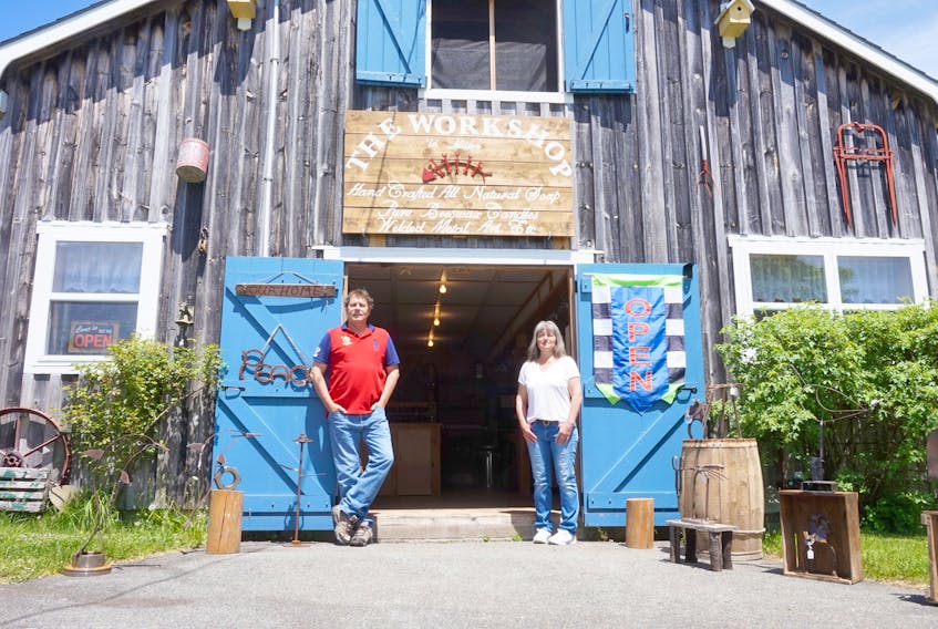 Mike and Heather Ferguson stand in front of the recently opened business, The Workshop in Milton. The shop opened at the beginning of May.