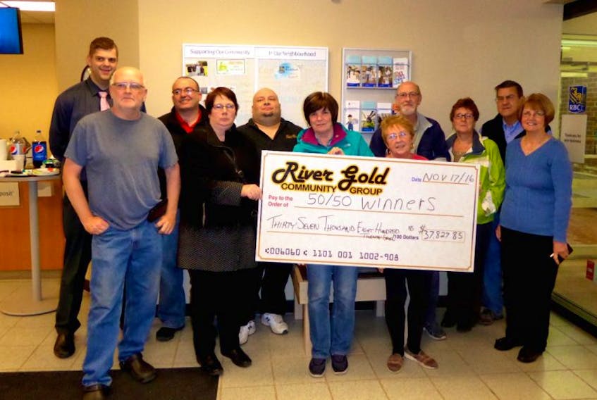 Pictured are some of the group volunteers and representatives proudly displaying a cheque showing the total jackpots awarded this year in the River Gold 50/50 Lottery (front, from left) Elmo Hewlett, Laura Ballard, Sheila Baird, Jean Mercer, Cory Locke; (back) Neil Bussey of RBC, Tony Kyritisis, Dave Canning (fundraising manager- River Gold Community Group), Jim Locke Gloria Locke and Albert Evans.
