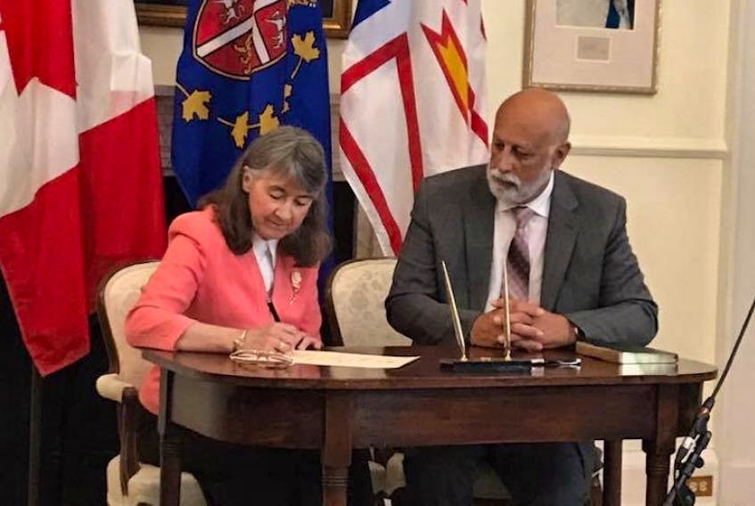 Al Hawkins was sworn in at Government House as Minister of Advanced Education, Skills and Labour on Monday following a cabinet shuffle by Premier Dwight Ball. 