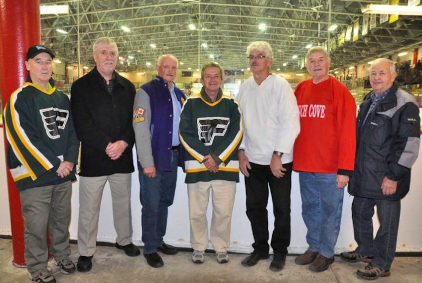 <p>Submitted photo/AESHL</p>
<p>To help celebrate the 50th anniversary of the Avalon East Senior Hockey League, a special tribute was paid to the original six teams that played in 1967-68 prior to last Friday’s season-opening game between the Northeast Eagles and Bell Island Blues at Jack Byre Arena in Torbay. Representing the original six teams were Neil Maynard (Flatrock Flyers), Gerry Cadigan (Outer Cove Marines), Bobby Gollop (Portugal Cove Legionnaires), Peter Clark (Flatrock Flyers), Marvin Whelan (Bauline Liners), Frank Murray (Pouch Cove Satellites) and Cyril Power (Torbay Royals). The official puck drop was conducted by former Flatrock player-coach Clark, who led the Flyers to the league's first-ever championship.</p>