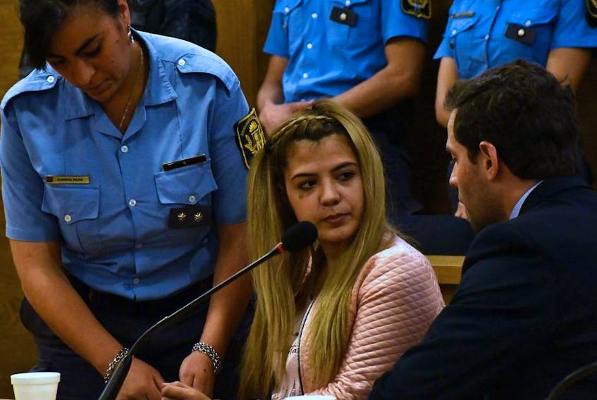 Photo released by Telam of Argentinian Brenda Barattini (C) during her trial in Cordoba, Argentina, on September 25, 2019. - Barattini was sentenced to 13 years for attempted homicide aggravated  with malice aforethought for cutting off her lover's genitals with pruning shears.