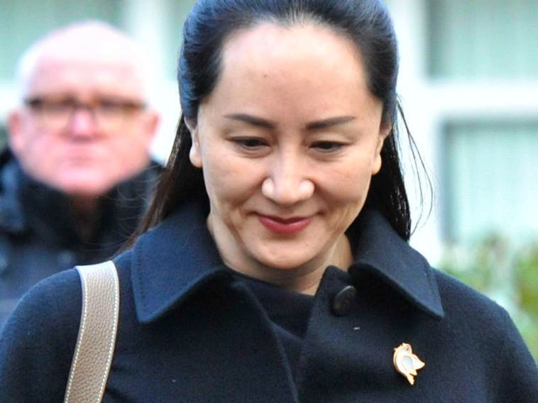 Huawei chief financial officer Meng Wanzhou leaves her Vancouver home with her security detail for an extradition hearing in British Columbia Supreme Court, on January 21, 2020 in Vancouver.