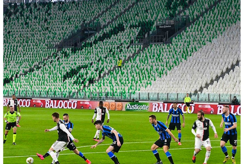 Inter Milan and Juventus players compete in an empty stadium due to the novel coronavirus outbreak during the Italian Serie A football match Juventus vs Inter Milan, at the Juventus stadium in Turin on March 8, 2020. 